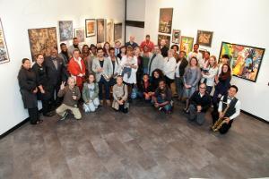 A photograph of over 50 people, students, faculty, and staff, at the opening of the new BHCC Artist in Residency program in the Mary Fifield Art Gallery