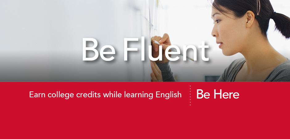 be fluent. earn college credits while learning english. student at a computer