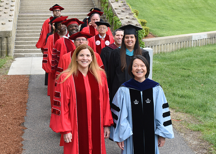 faculty commencement procession lead by President Eddinger and Rosalin Acosta