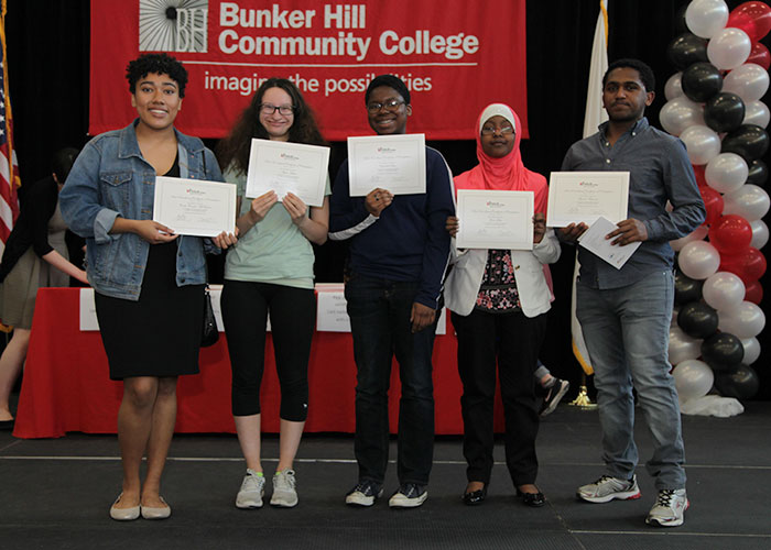 dual enrollment students posing with certificates