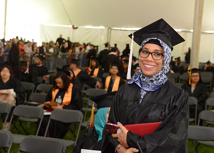 smiling female student with diploma