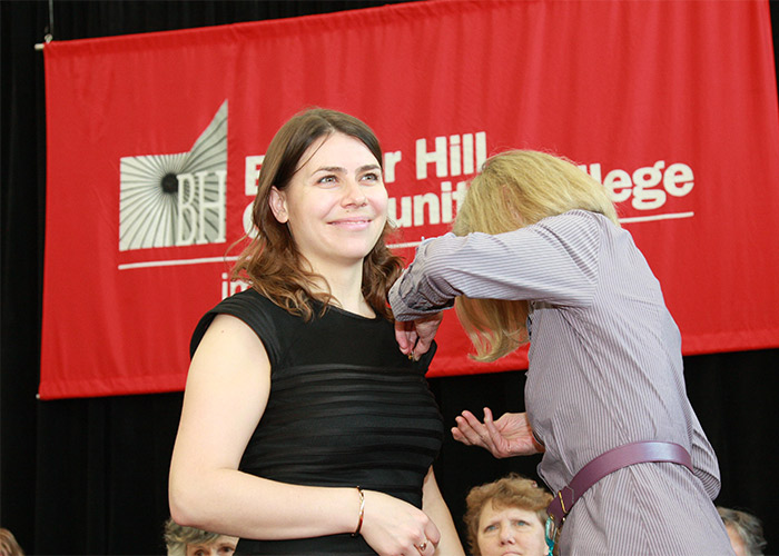 female student receives her nurse pin