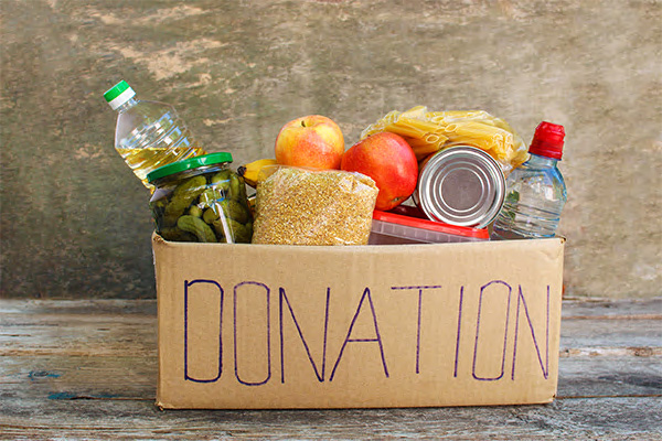 Food inside a box with Donations written on the box