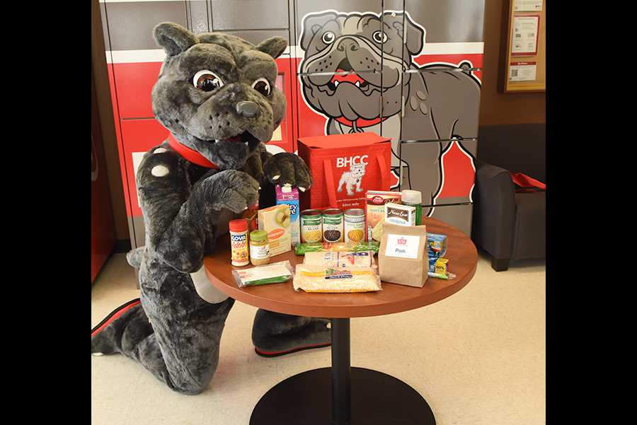 Charlie the mascot with food from DISH