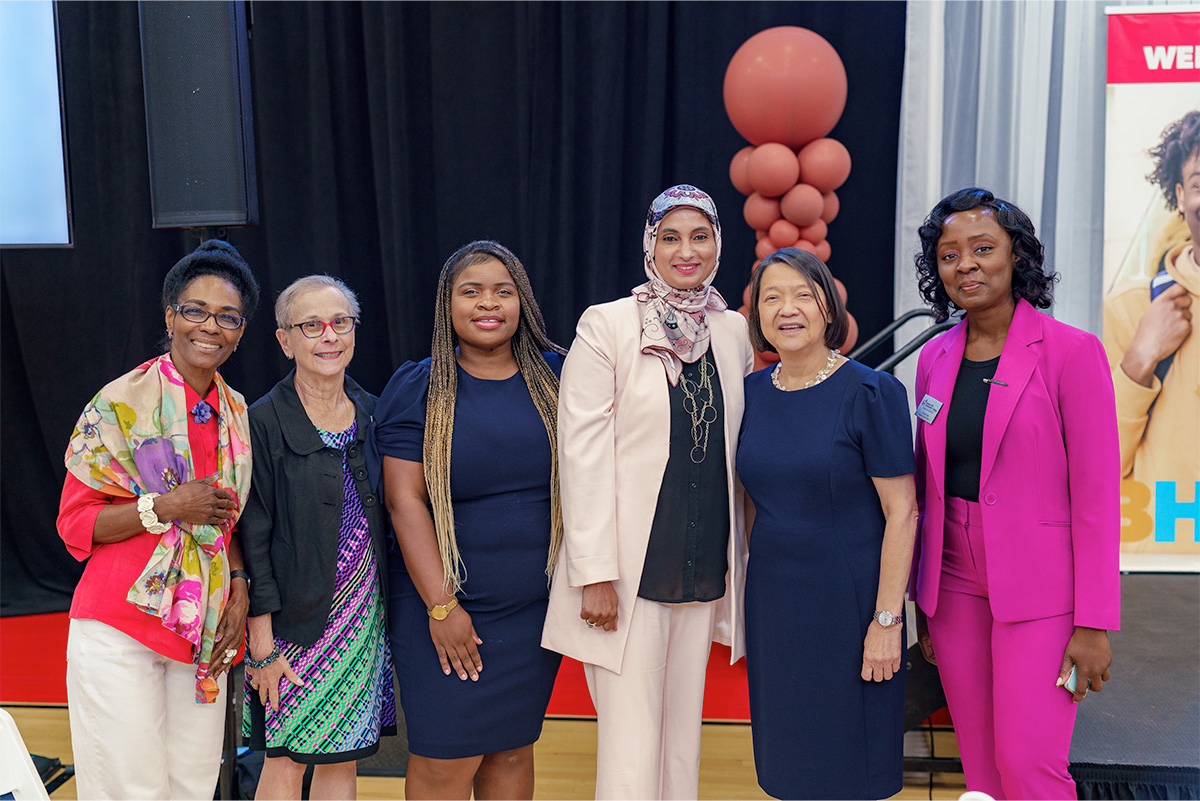 faculty and staff on stage at convocation