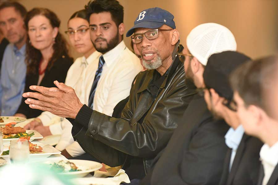 Kareem Abdul-Jabbar talking to faculty and students