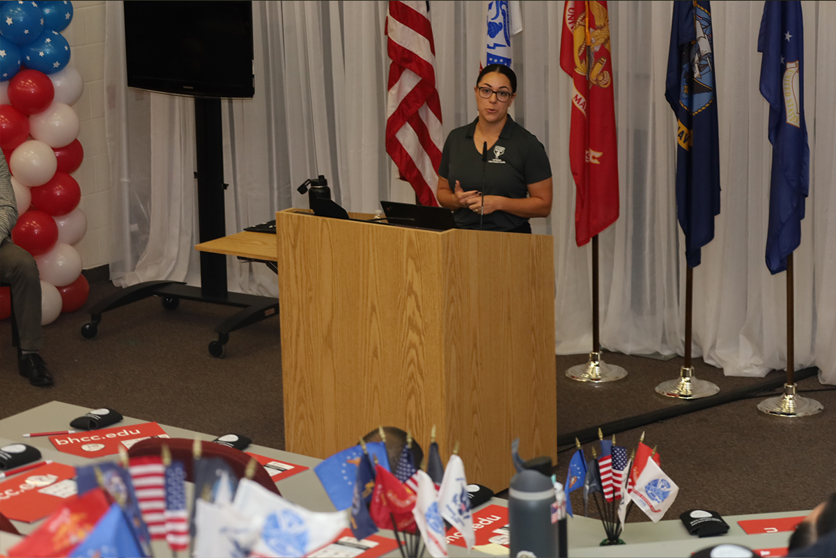 woman speaking at a podium