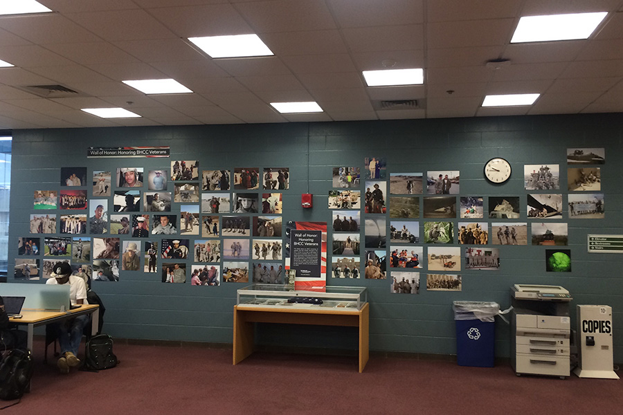 Wall of Honor Veterans Day photo display in the BHCC library