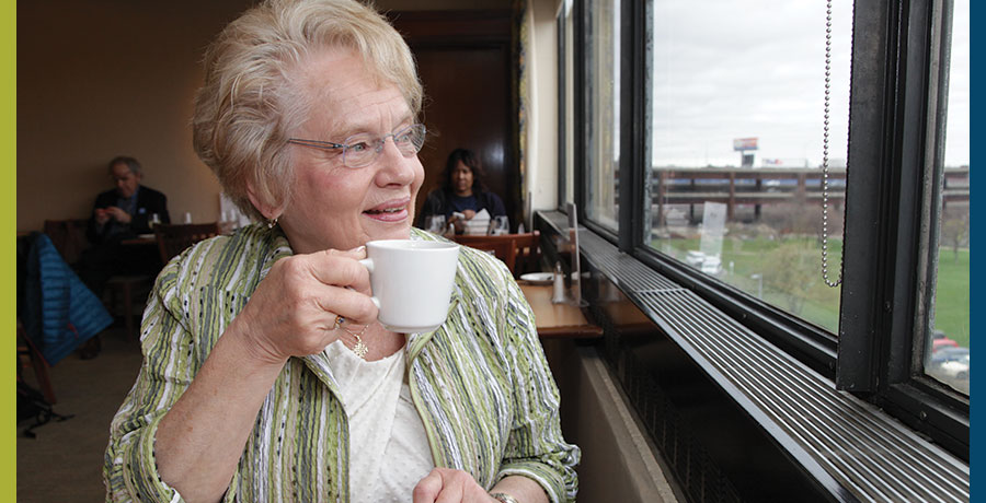 Professor Adele Hamblett enjoying a beverage in the Kershaw Dining Room.