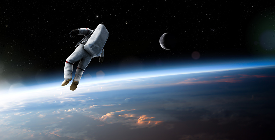 Science in Space Begins on Earth Banner - Picture of an astronaut on a space walk above the Earth.