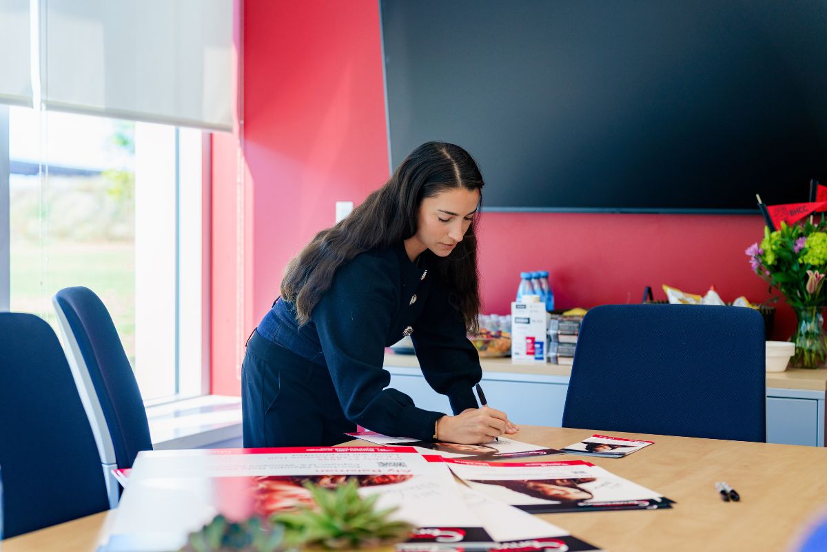 Aly raisman in conference room