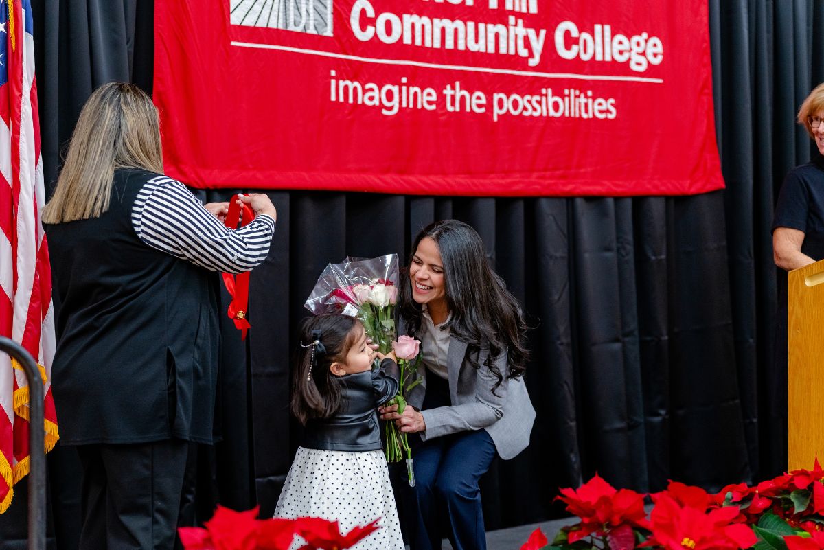 Nursing student hugging family