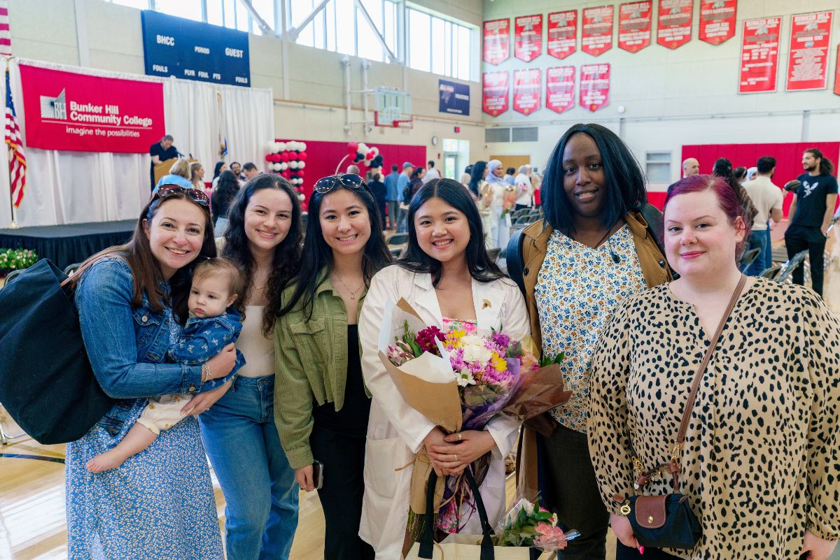 Student with family and friends