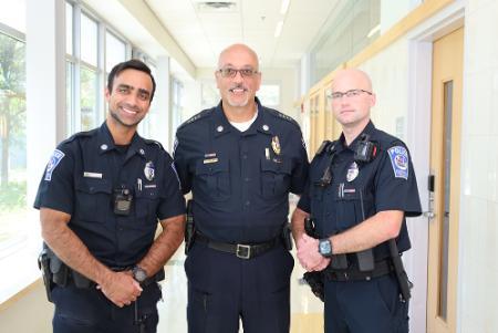 Officers Azam Khan and Keith Letourneau and chief barrows