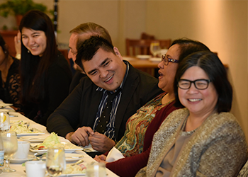 Jose Vargas laughing with guests at the Difficult Dialogues luncheon 