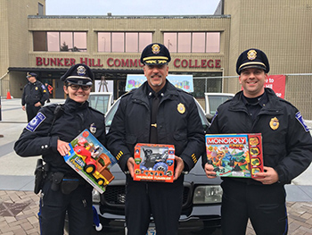three officers at BHCC Stuff a Cruiser event